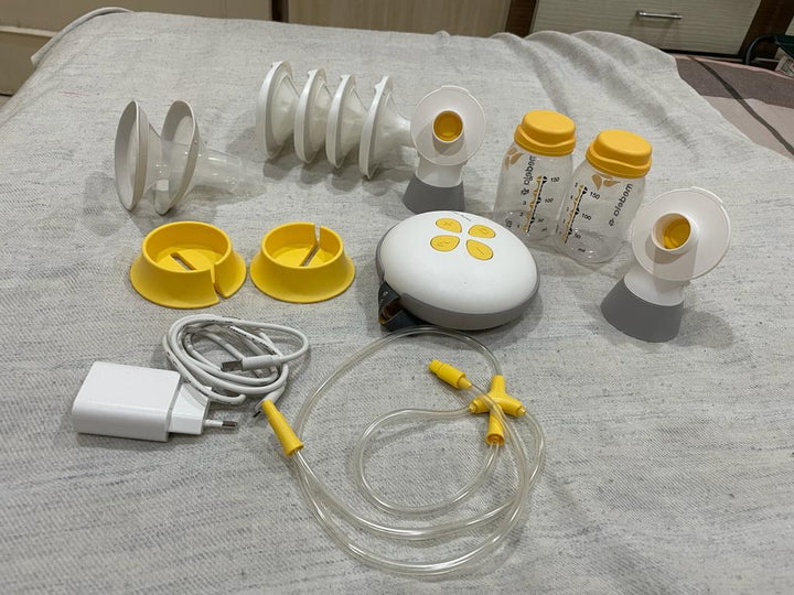 Medela Swing Maxi Breast Pump With extra flnges